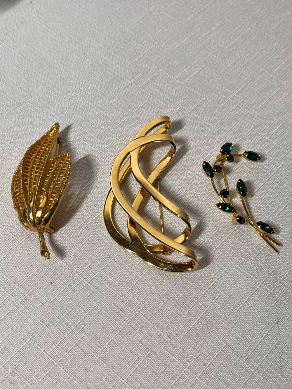 3 Gold-Tone vintage Brooches.  Swirl, leaf, green stones. Beauties!